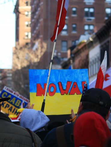 Sunday, February 27, 2022, Protesters gathered outside of Russian Consulate in uptown New York City to protest Russian's invasion in Ukraine. Sign reads "NO WAR".