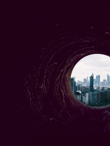 Photo of a dark hole leading up to Canary Wharf, London (the banking district)