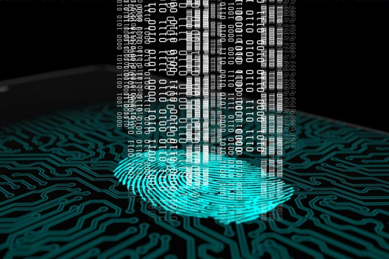 Photo of a fingerprint with matrix-like codes flying upwards out of it