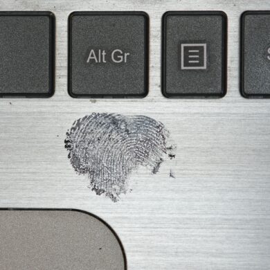 Photo of a clear fingerprint mark left on a Laptop surface with black-ink