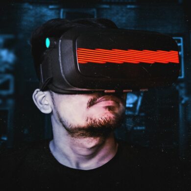 Photo of a man wearing a virtual reality (VR) headset, depicting an increasing trend towards the metaverse