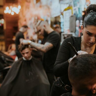 People getting haircuts at a barbershop