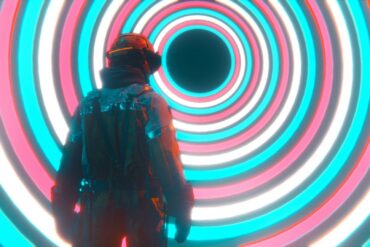 A man wearing a VR headset looking into a big hypnotising circular design