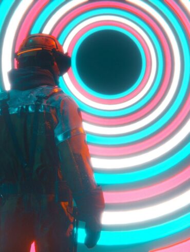 A man wearing a VR headset looking into a big hypnotising circular design