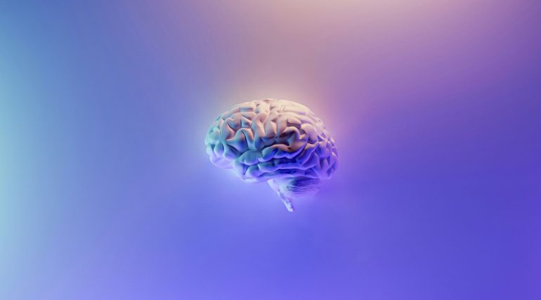 A clean blue brain with a purple graded background, depicting the mind of artificial intelligence