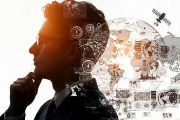 A side-profile silhouette of a man wearing glasses and a suit, with his hand resting on his chin in a contemplative "thinker" pose including a designed overlay with a complex digital collage featuring a wireframe globe, network connections, and various data interface elements.